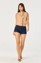 Load image into Gallery viewer, Woman wearing a beige sleeveless knitted ASTR cardigan with tie neck and buttons on a white background
