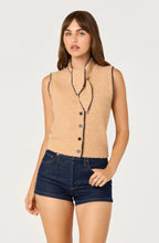 Load image into Gallery viewer, Woman wearing a beige sleeveless knitted ASTR cardigan with tie neck and buttons on a white background