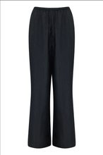 Load image into Gallery viewer, Black NUDE LUCY Pandora pants on a white background