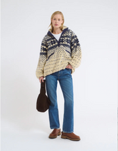 Load image into Gallery viewer, Woman wearing a patterned sweater and jeans on a white background