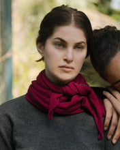 Load image into Gallery viewer, Woman wearing a red scarf with another person partially visible in the background
